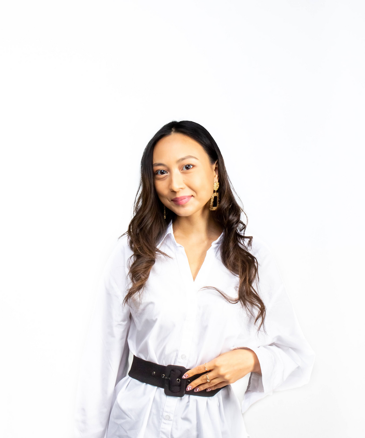 Ethnically ambiguous young woman in business attire.
