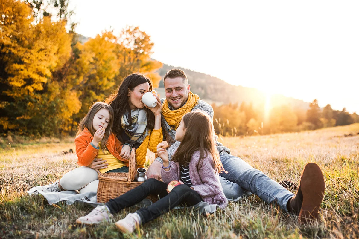 Caucasian family enjoying a fall picnic